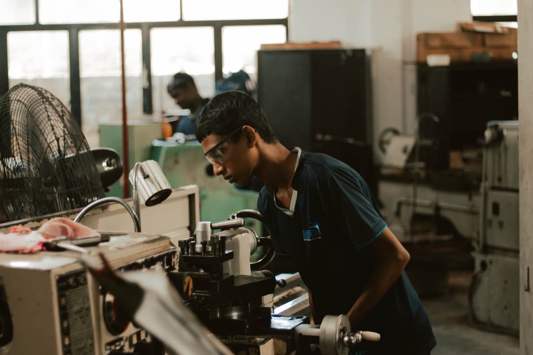 Engineer operating precision machinery